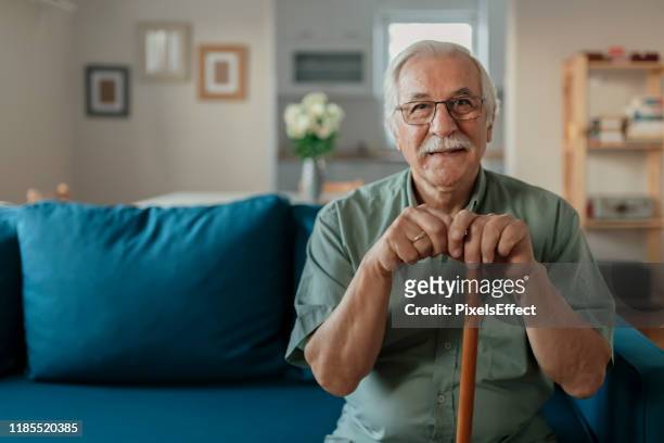 retrato de happy senior man - walking cane fotografías e imágenes de stock