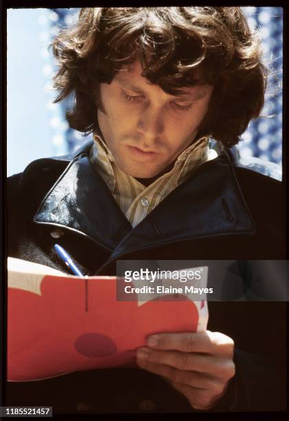 Jim Morrison signs autographs at Fantasy Fair in Marin County, California, during the Summer of Love, 1967;