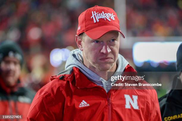 Head coach Scott Frost of the Nebraska Cornhuskers walks off the field after the loss against the Iowa Hawkeyes at Memorial Stadium on November 29,...