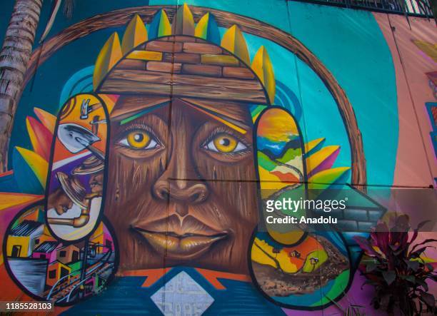 Mural is seen in Commune 13 of Medellin, Colombia on November 29, 2019. Medellin is experiencing an increase in its national and foreign visitors at...