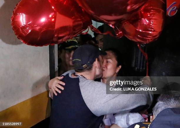 Peruvian politician Keiko Fujimori kisses her husband Mark Villanella upon her release from prison in Lima on November 29, 2019. - Peru opposition...