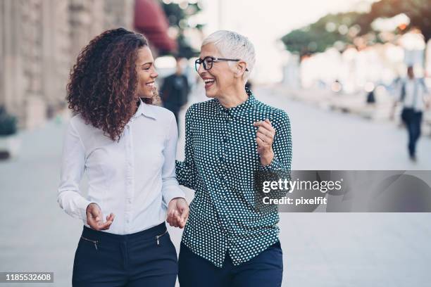 business and friendship - professionals speaking outside stock pictures, royalty-free photos & images