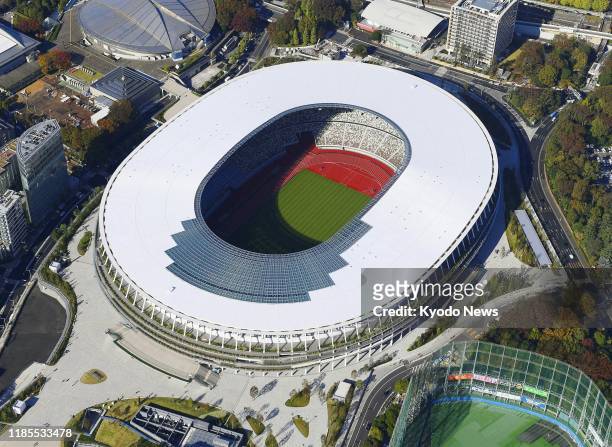 Photo taken from a Kyodo News helicopter on Nov. 15 shows the new National Stadium, the main venue for the 2020 Tokyo Olympics and Paralympics, that...
