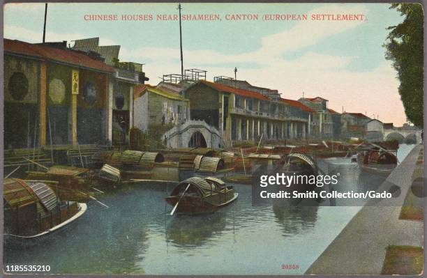Illustrated postcard of sampan boats floating in a canal and Chinese-style houses located along the bank, in the European settlement at Shameen , an...