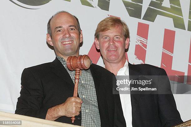 Storm chaser Sean Casey and producer Don Kempf ring the closing bell at the New York Stock Exchange on July 8, 2011 in New York City.