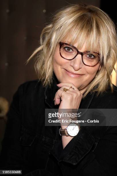 Columnist and host of French radio and television, Caroline Diament poses during a portrait session on October 15, 2019 in Paris, France.
