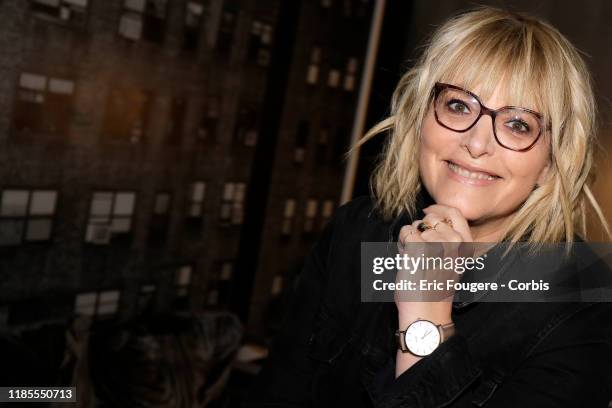 Columnist and host of French radio and television, Caroline Diament poses during a portrait session on October 15, 2019 in Paris, France.