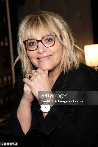 Columnist and host of French radio and television, Caroline Diament poses during a portrait session on October 15, 2019 in Paris, France.