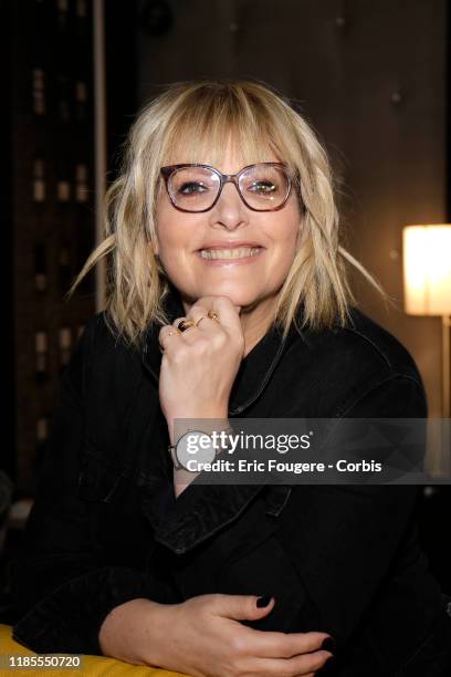 Columnist and host of French radio and television, Caroline Diament poses during a portrait session on October 15, 2019 in Paris, France.