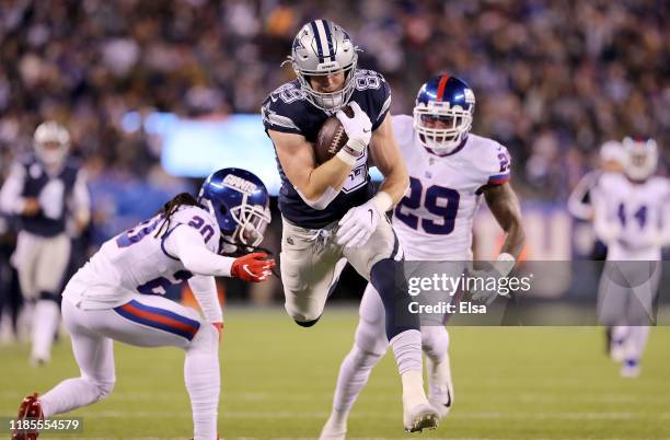 Tight end Blake Jarwin of the Dallas Cowboys runs in for a touchdown in the second quarter over the defense of the New York Giants at MetLife Stadium...