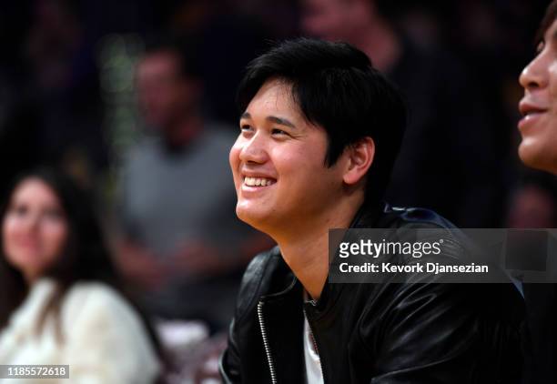 Pitcher Shohei Ohtani of the Los Angeles Angels of Anaheim attends a basketball game between the Washington Wizards and the Los Angeles Lakers at...