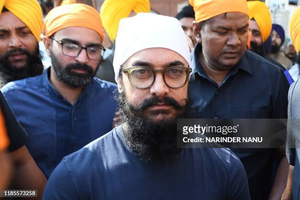 Bollywood actor Aamir Khan pays respect at the Golden Temple during his visit for the shooting of the upcoming film 'Laal Singh Chaddha' in Amritsar...