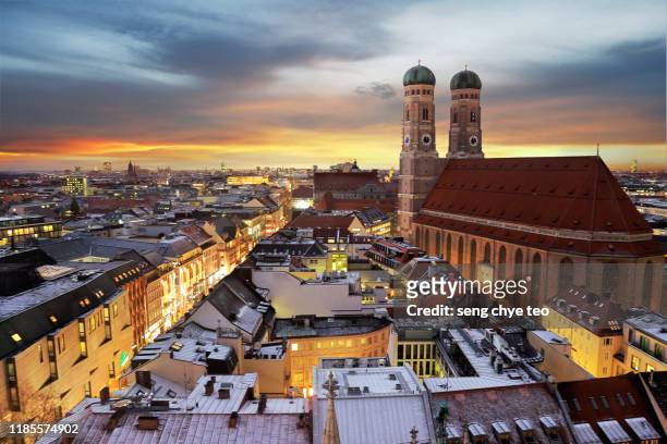 sunset over munich's skyline - munich stock pictures, royalty-free photos & images