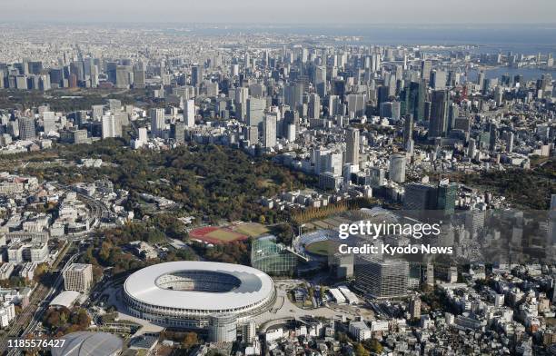 Photo taken from a Kyodo News helicopter on Nov. 30 shows the new National Stadium, the main venue for the 2020 Tokyo Olympics and Paralympics, that...