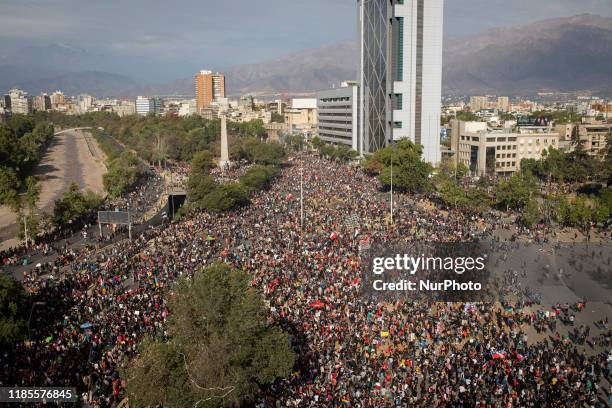 People gather for an anti-government protest in Santiago, Chile, Friday, Nov. 1, 2019. Groups of Chileans continued to demonstrate as government and...