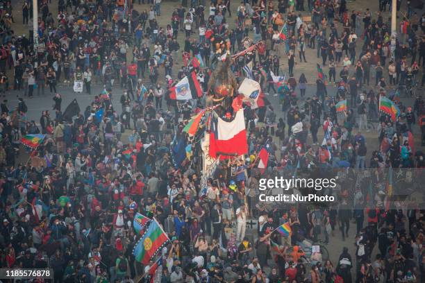 People gather for an anti-government protest in Santiago, Chile, Friday, Nov. 1, 2019. Groups of Chileans continued to demonstrate as government and...