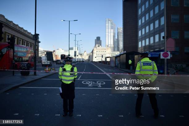 Pollice officers guard the scene of yesterday's London Bridge stabbing attack as investigations continue on November 30, 2019 in London, England. A...