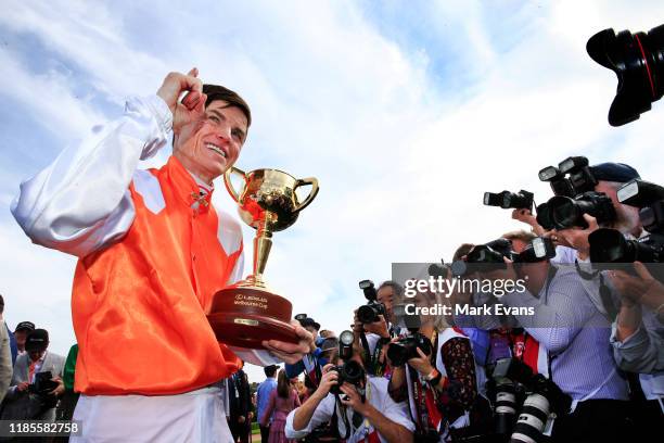 Craig Williams poses for photographers after winning the Melbourne Cup with Vow And Declare during 2019 Melbourne Cup Day at Flemington Racecourse on...