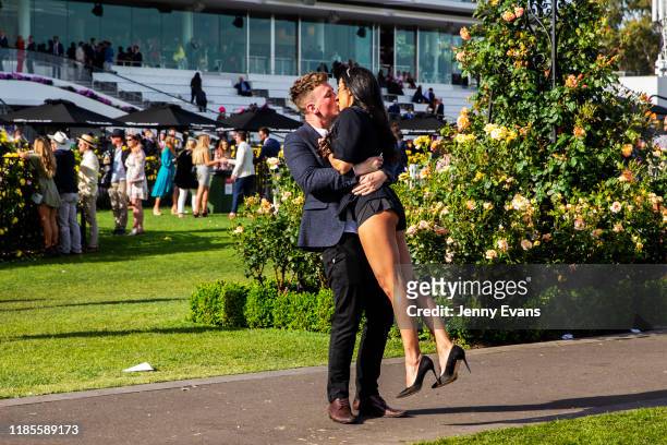 Race-goers share a kiss after the 2019 Melbourne Cup Day at Flemington Racecourse on November 05, 2019 in Melbourne, Australia.
