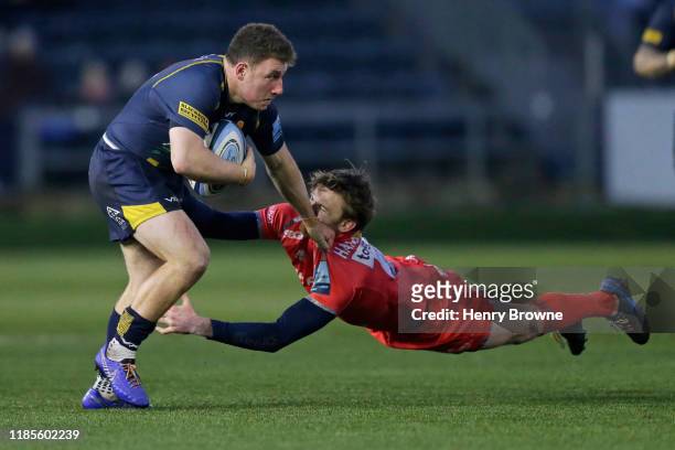 Duncan Weir of Worcester Warriors is tackled by Simon Hammersley of Sale Sharks during the Gallagher Premiership Rugby match between Worcester...