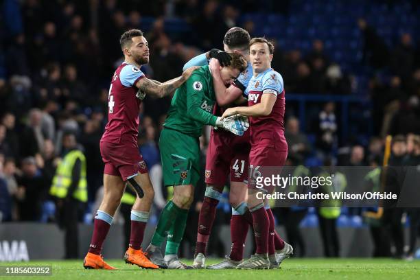 Ryan Fredericks, Angelo Ogbonna, Declan Rice and captain Mark Noble celebrate their 1-0 victory with an emotional West Ham goalkeeper David Martin...