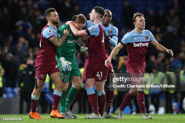 Ryan Fredericks, Angelo Ogbonna, Declan Rice and captain Mark Noble celebrate their 1-0 victory with an emotional West Ham goalkeeper David Martin...