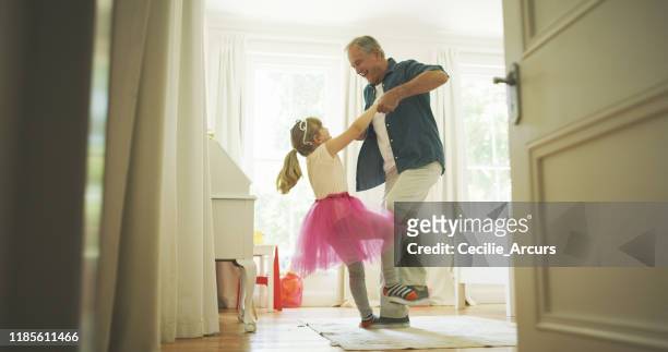 grandpa knows just how to make her feel like royalty - grandfather stock pictures, royalty-free photos & images