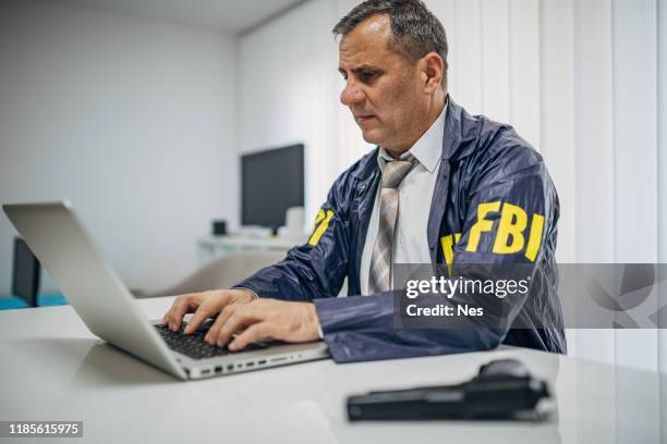 14 Fbi Agent Working On Laptop Stock Photos, High-Res Pictures, and ...