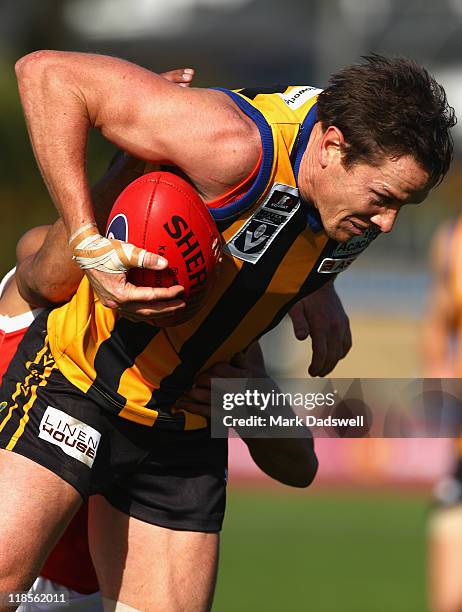 Jason Blake of the Zebras attempts to break a tackle during the round 15 VFL match between Sandringham and the Northern Bullants at Trevor Barker...