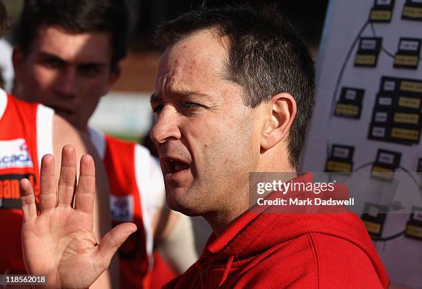 Darren Harris coach of the Bullants addresses his team during the round 15 VFL match between Sandringham and the Northern Bullants at Trevor Barker...