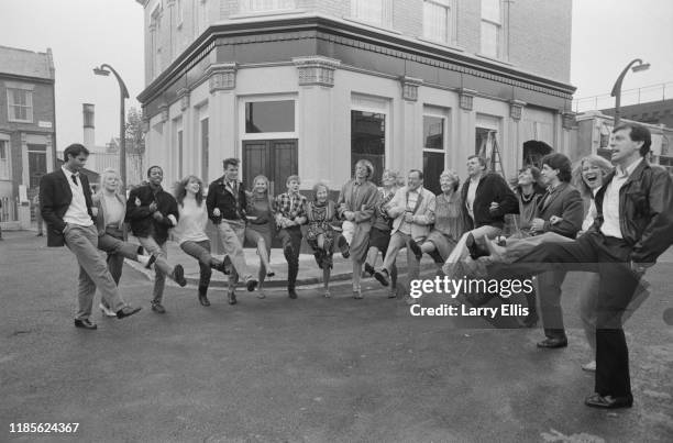 Cast members from the BBC television soap opera EastEnders together on the Albert Square set at Elstree Studios in Elstree, UK, 11th October 1984;...