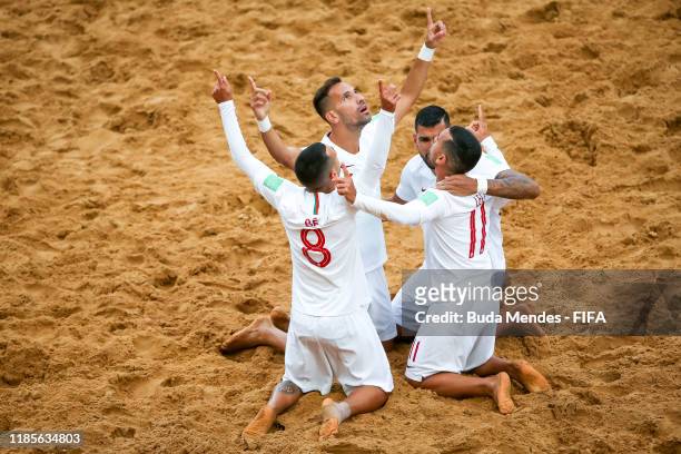 Leo Martins of Portugal celebrates a goal with his teammates during the FIFA Beach Soccer World Cup Paraguay 2019 semi final match between Japan and...