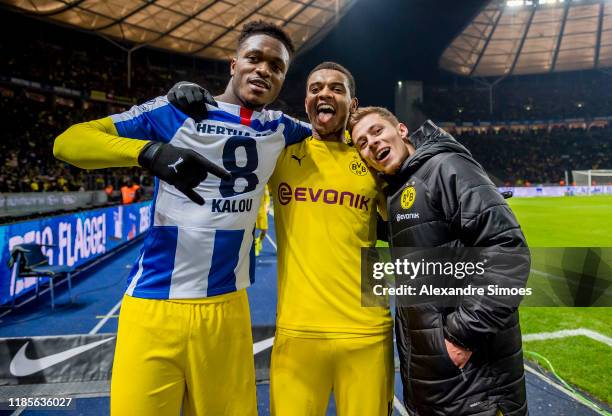 Dan-Axel Zagadou, Manuel Akanji, and Thorgan Hazard of Borussia Dortmund celebrates after winning the Bundesliga match between Hertha BSC and...