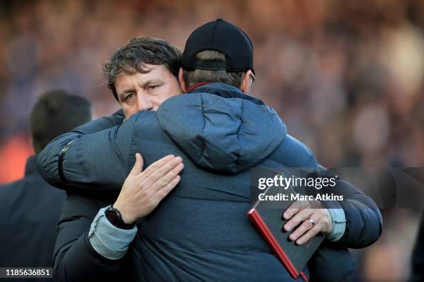 Liverpool assistant manager Peter Krawietz embraces Jurgen Klopp during the Premier League match between Liverpool FC and Brighton & Hove Albion at...