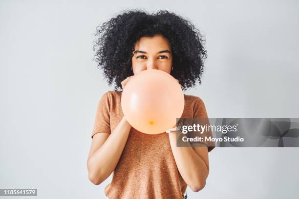 balloons excite me - blowing up balloon stock pictures, royalty-free photos & images