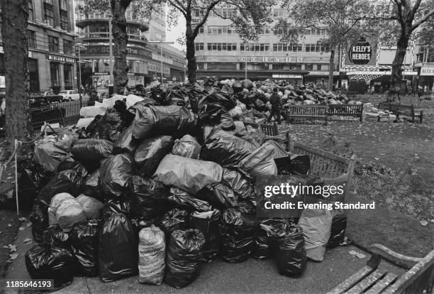 Plastic bags of rubbish pile up in Leicester Square during a strike by council waste collectors and binmen in London on 30th October 1970.