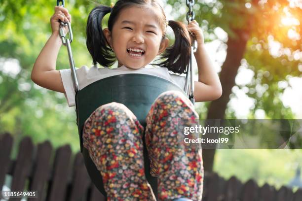 cute girl swinging - swinging stock pictures, royalty-free photos & images