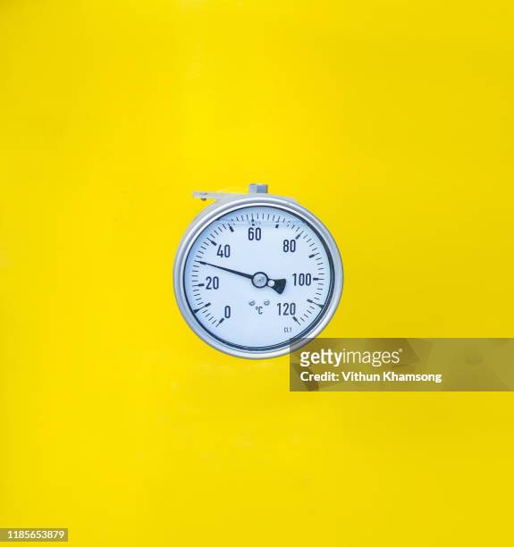 pressure gauge at industrial zone on yellow background - pressure gauge stock pictures, royalty-free photos & images