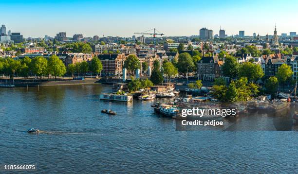 classical city scenic from amsterdam in the netherlands - amsterdam aerial stock pictures, royalty-free photos & images