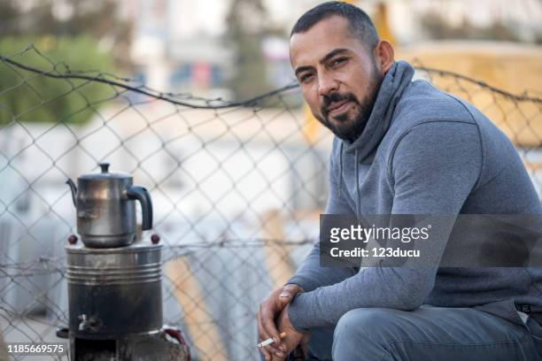 syrian man - refugee portrait stock pictures, royalty-free photos & images