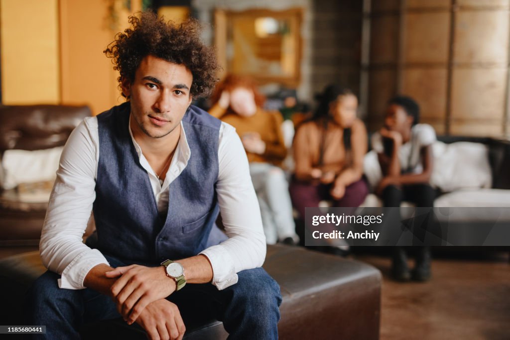 Portrait of young man looking into camera