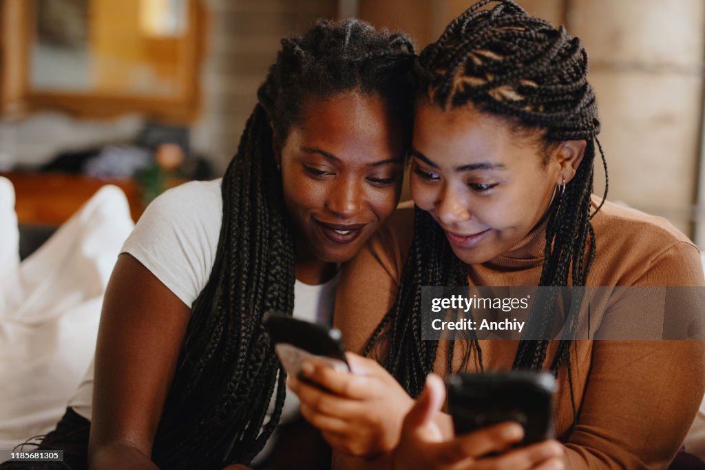 Women looking at phone using Internet dating app