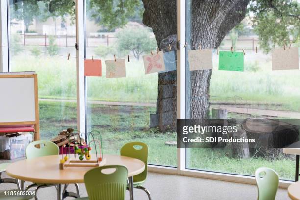 a kindergarten classroom awaits students - preschool art stock pictures, royalty-free photos & images