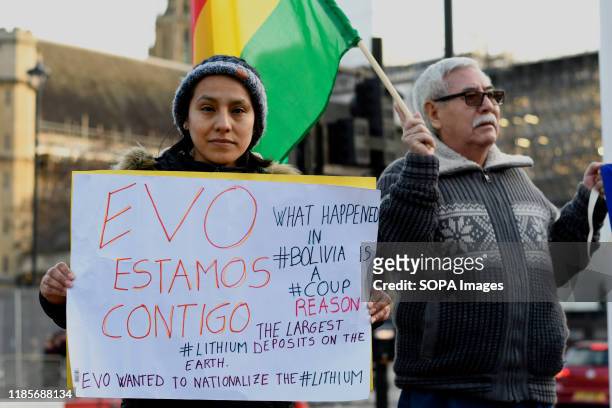 Protester holds a placard during the demonstration. People gathered outside Downing Street to raise their voices against the coup in Bolivia and show...