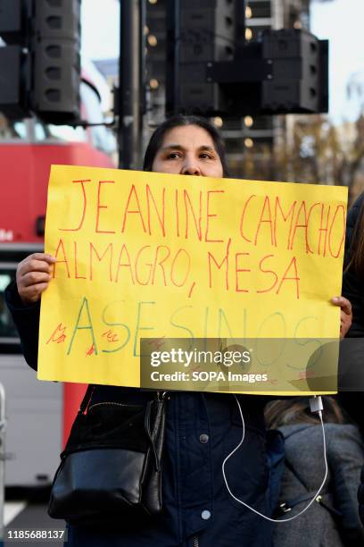 Protester holds a placard during the demonstration. People gathered outside Downing Street to raise their voices against the coup in Bolivia and show...