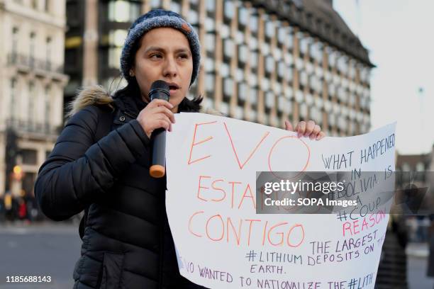 Protester holds a placard during the demonstration. People gathered outside Downing Street to raise their voices against the coup in Bolivia and show...