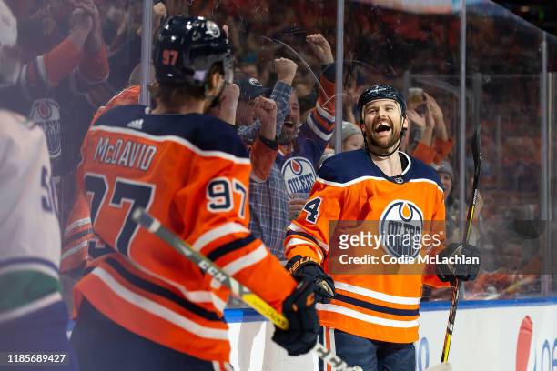 Connor McDavid and Zack Kassian of the Edmonton Oilers celebrate Kassians goal against the Vancouver Canucks at Rogers Place on November 30, 2019 in...