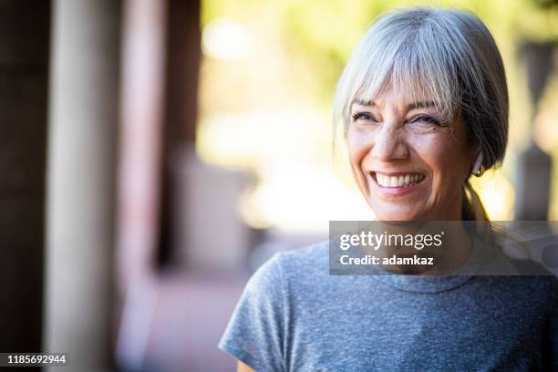 smiling senior woman during workout - active senior woman imagens e fotografias de stock