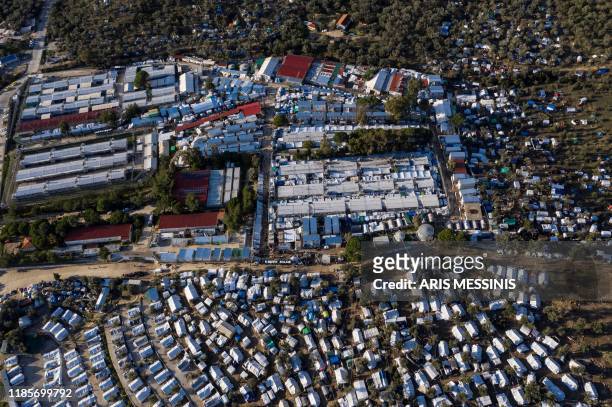 Picture taken on December 1, 2019 shows an aerial view of the official refugee camp of Moria and the makeshift camp around it, on the island of...