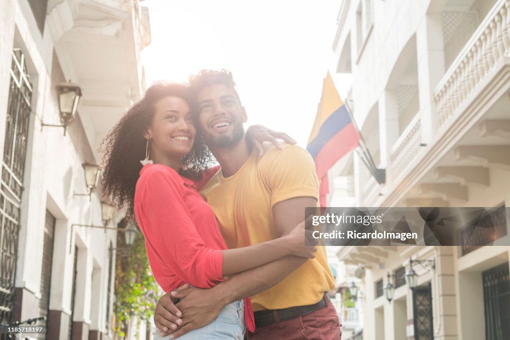 Latino couple hugging in downtown Cartagena